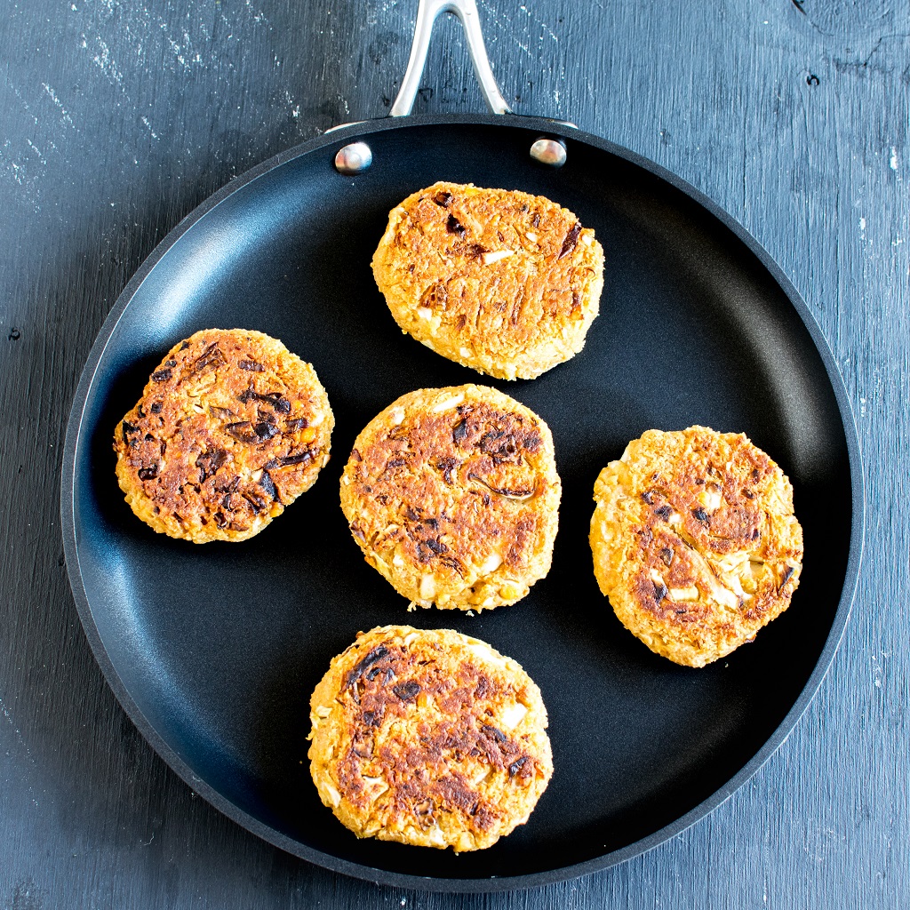 Thai Peanut Chickpea Patties are shown on the crepe pan while they are being cooked | kiipfit.com