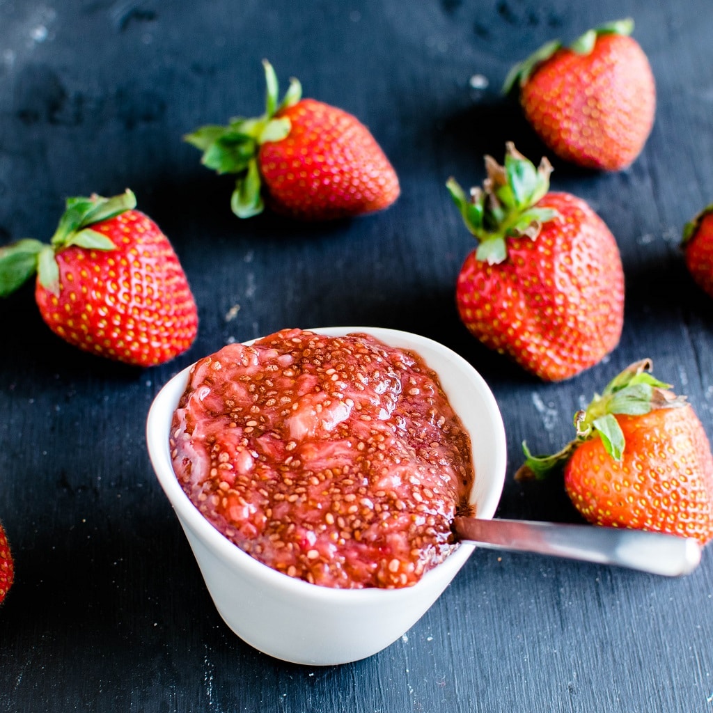 Strawberry jam in white small jar is shown in this image | kiipfit.com